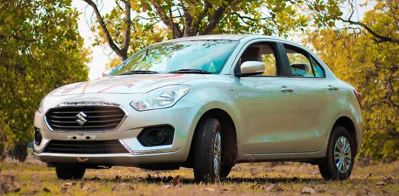 Swift Dzire sedan interior — comfortable AC cabin for Ahmedabad city rides